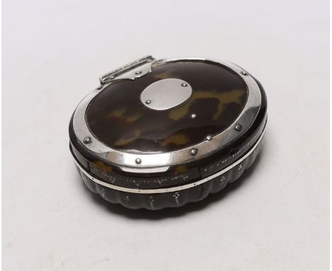 An early 19th century unmarked white metal mounted oval tortoiseshell snuff box, with fluted base, 92mm.