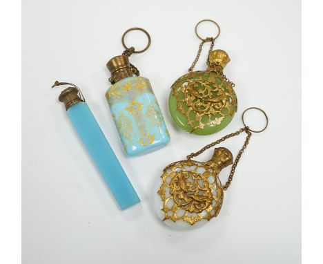 A group of four glass scent bottles with gilt metal mounts, largest 9cm high First image far-left clockwise: blue glass good;