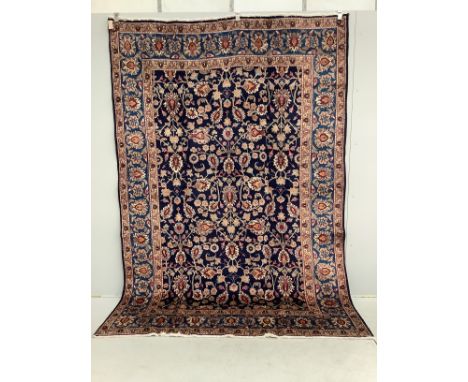 A Kashan blue ground carpet, 290 x 195cm