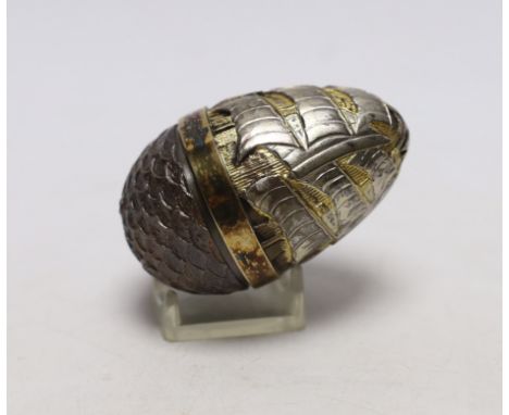 An Elizabeth II parcel gilt silver and enamel surprise egg, by Stuart Devlin, London, 1989, numbered 20, opening to reveal sa