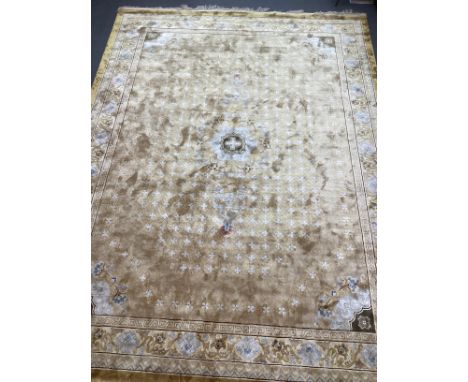 A Chinese gold ground carpet, 370 x 280cm No visible signs of any damage or repairs. Some minor spot stains.