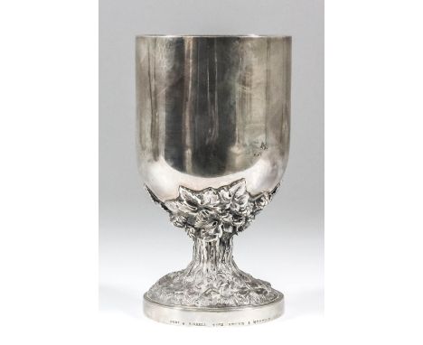 A Victorian silver and silver gilt goblet with plain cylindrical body, the stem cast with hops and rustic pattern support, on