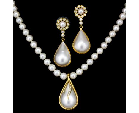 A modern 14ct gold mounted pearl and diamond tear drop pendant, 32mm drop, suspended on a single strand of cultured pearls, 4