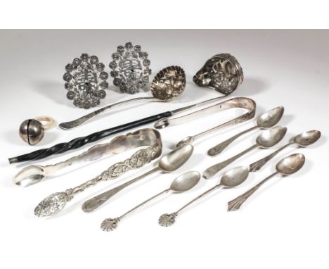 A George III silver and silver gilt sugar sifter spoon, the oval pierced bowl embossed and chased with berries, the handle en