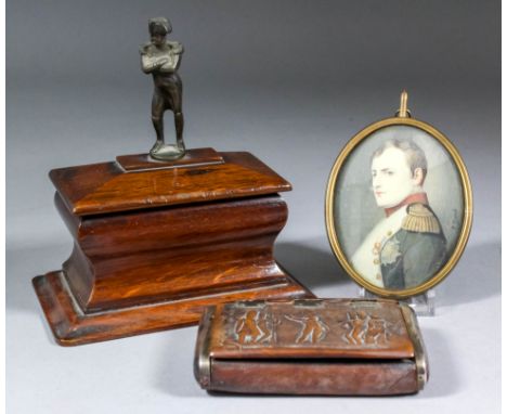 Of Napoleonic interest - a small 19th Century oak sarcophagus shaped box and lid surmounted by a bronze figure of the Emperor