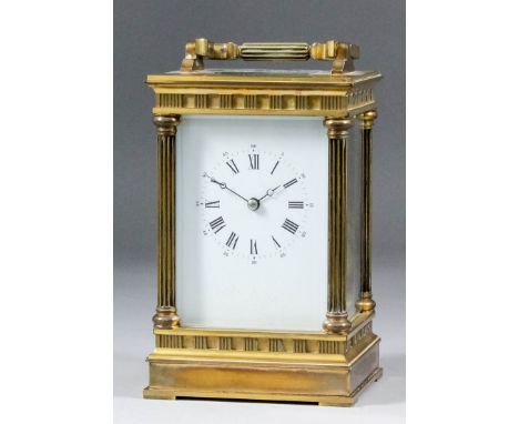 An early 20th Century carriage clock, the white enamel dial with Roman and Arabic numerals, to the eight day two train moveme