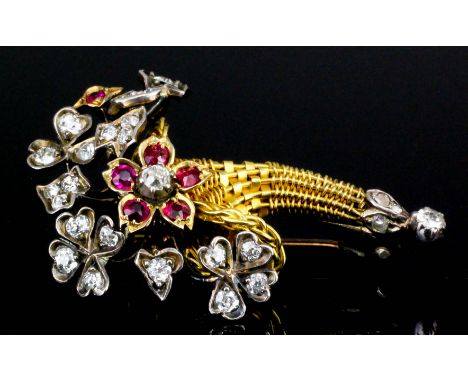 A 19th Century gold coloured metal mounted diamond and ruby posy pattern brooch, the wirework basket set with old cut diamond