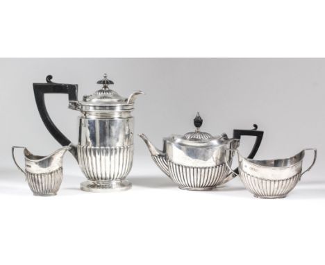 A late Victorian silver cylindrical and part reeded hot water pot with angular ebonised handle and reeded finial, on circular