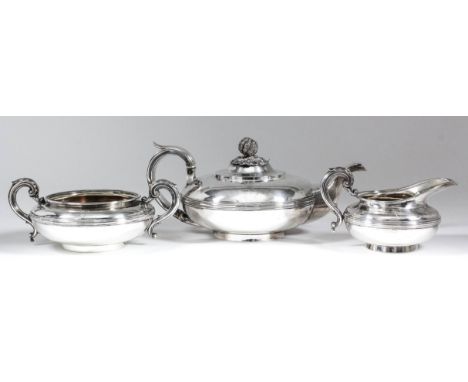 A George IV/William IV silver circular three-piece tea service of bulbous squat form with moulded rim and girdle to body, lea