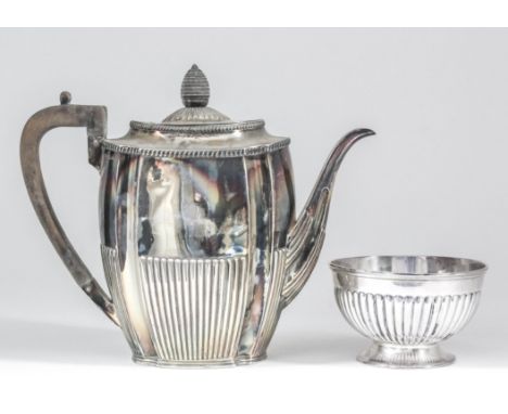 A late Victorian silver oval coffee pot with reentrant corners, gadroon mounts and part reeded body, ebonised angular scroll 