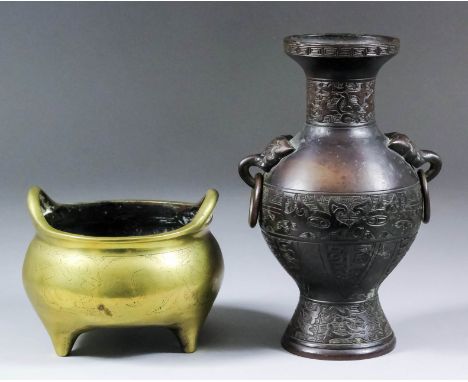 A Chinese brown patinated bronze two-handled vase of archaic form, 7.25ins (18.5cm) high, and a Chinese bronze two-handled ce