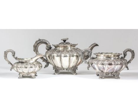 A George IV and William IV harlequin silver three-piece tea service, the circular squat lobed bodies with shaped and moulded 