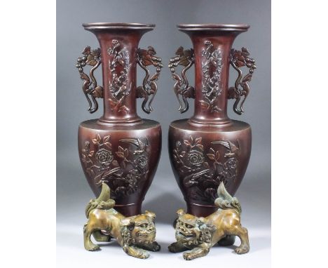 A pair of 20th Century two-handled Chinese bronze vases, the sides and necks cast with birds amongst flowering plants, 17.75i