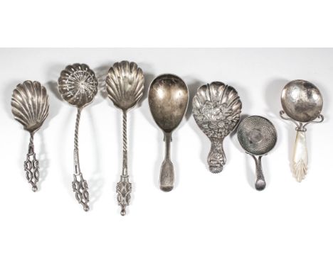 A late Victorian silver caddy spoon with shell pattern bowl, spiral twist and moulded pierced handle, by Josiah Williams &amp