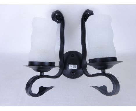 Set of eleven black finish wrought metal single branch light fittings with opaque glass shades, and two similar two branch fi