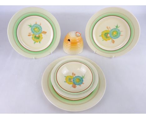 Clarice Cliff Newport Pottery honey pot and three Clarice Cliff Newport pottery 'Honey Dew' pattern plates and a matching bow