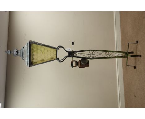19th century metal street lamp lantern, glazed with bottle end effect glass on later wrought metal base (H217cm), and a car l