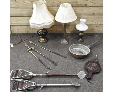 A collection of items, to include bellows, a shooting stick, table lamps and fire tools