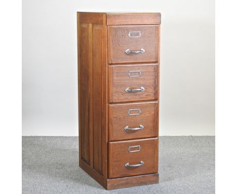 A mid 20th century light oak filing cabinet, containing four drawers, 45cm
