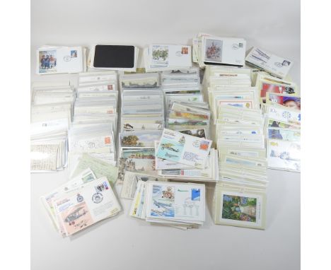 A large collection of vintage postcards, together with a collection of first day covers