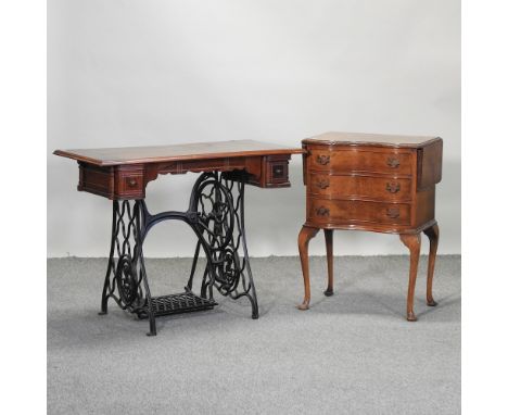 A 1930's walnut side table, 55cm, together with a vintage sewing machine table, on a metal base