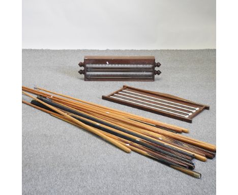 A mid 20th century vintage wooden scoreboard, 87cm, together with another, 86cm and various snooker cues, rests, balls, brush