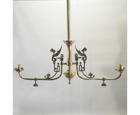 A brass double ceiling light, with Egyptian style decoration, 75cm wide