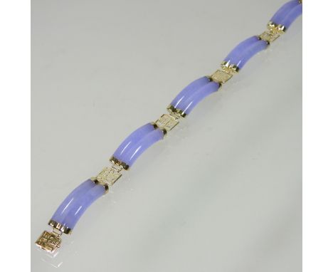 A 14 carat gold and lavender jade coloured hardstone bracelet