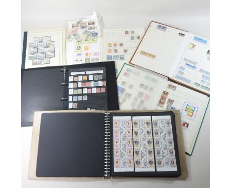 A stamp album, together with three others, and a folder, containing mainly British and Commonwealth stamps