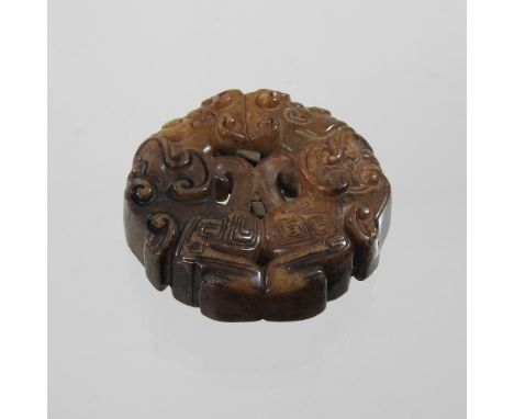A jade coloured hardstone roundel, 6cm diameter