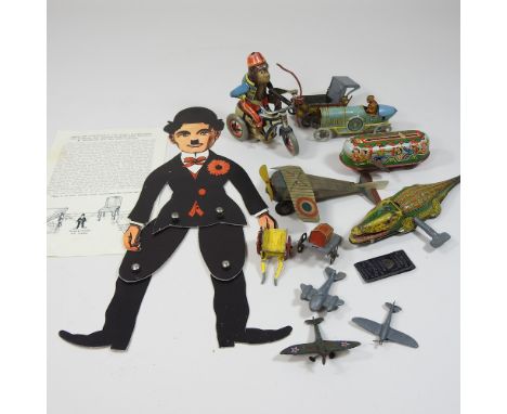 A collection of vintage and tinplate toys