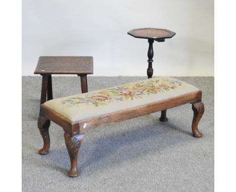 An early 20th century walnut tapestry footstool, 92cm, together with a chinoiserie occasional table and a carved occasional t