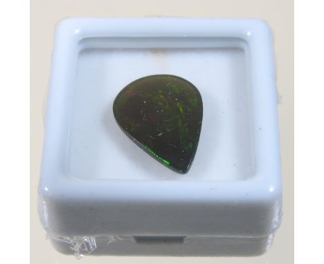 An unmounted black opal, 2.91 carats, with certificate