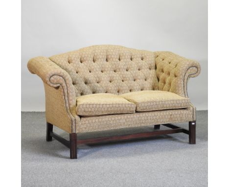 A gold upholstered button back sofa, 164cm