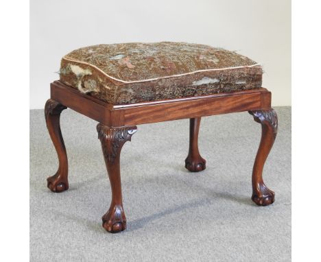 A Chippendale style footstool, on claw and ball feet, 61cm