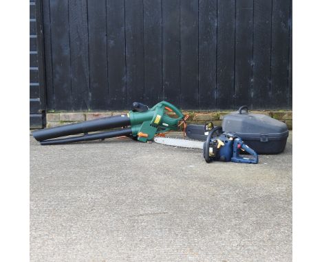 An electric garden leaf blower, together with a petrol chainsaw