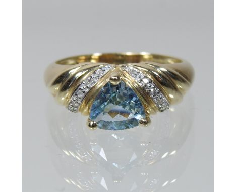 A 9 carat gold light blue topaz and diamond ring, boxed, size N