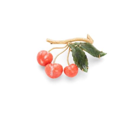 Y A coral and jade brooch modelled as cherries on a branch, comprising three carved and polished coral cherries and two carve