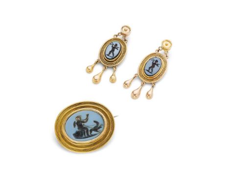 A late 19th century intaglio brooch and earrings each set with a hardstone intaglio of a cherub playing a horn in a border of