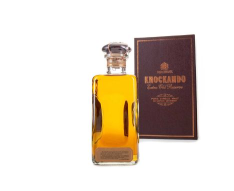 KNOCKANDO EXTRA OLD RESERVESingle malt.This bottle of Knockando's Extra Old Reserve is missing its front labels, so there is 