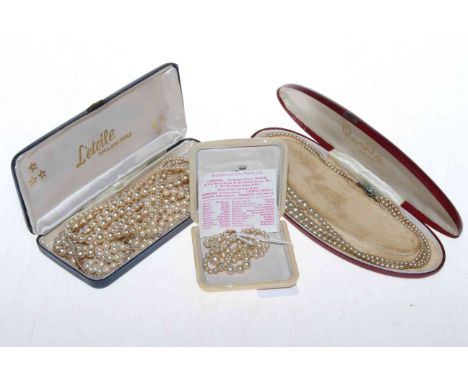 Collection of pearl necklaces in three boxes.