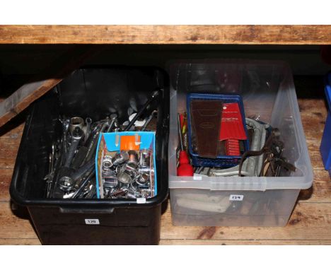Two boxes of tools and sockets.