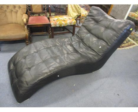 A black leather button back, upholstered chaise long, 32"h, 71" w 