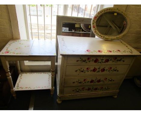 A white painted chest of drawers, a matching two tier table and oval wall mirror, each with painted pink and blue rose decora