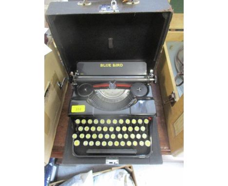 A Blue Bird manual typewriter in a carrying case 