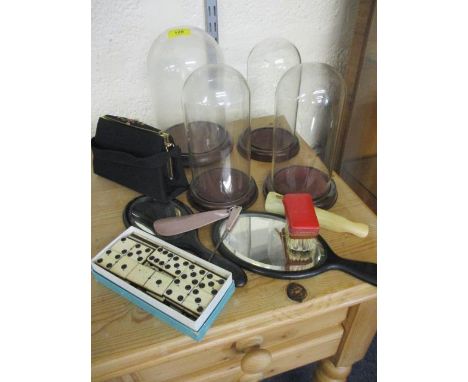 Four domed glass display cases, a vintage evening bag, mixed brushes and mirrors and vintage bone dominoes 