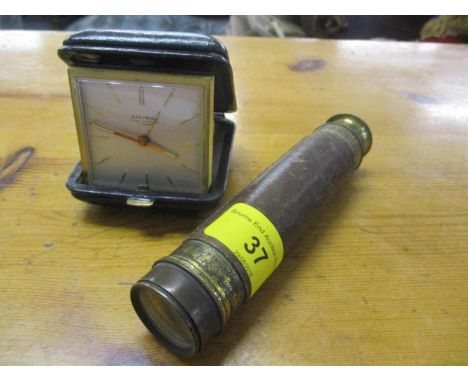An early 20th century telescope, together with an Amyral travelling bedside clock 
