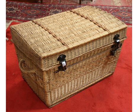 A large willow wicker trunk with locking bar, lock and keys.