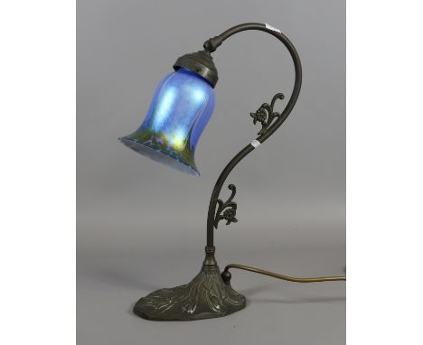 A C20th table lamp with tulip shaped painted glass shade.