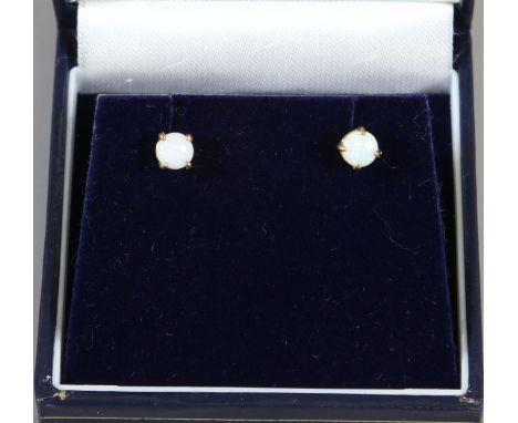 A pair of 9 carat gold opal stud earrings.